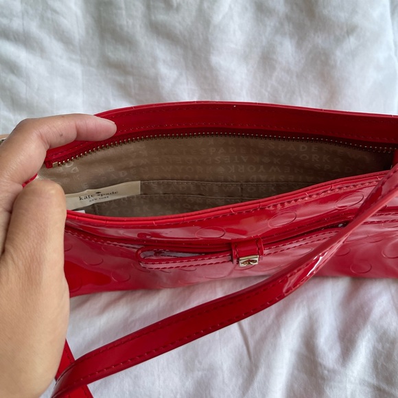 Kate Spade New York
Camellia Street Amy Bow Purse Patent Red Polka Dot Crossbody - Picture 2 of 2